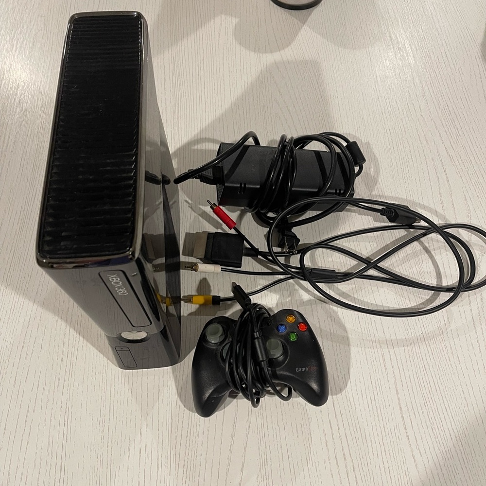 Xbox 360 slim 250GB storage with controller, power cord, and A/V cable